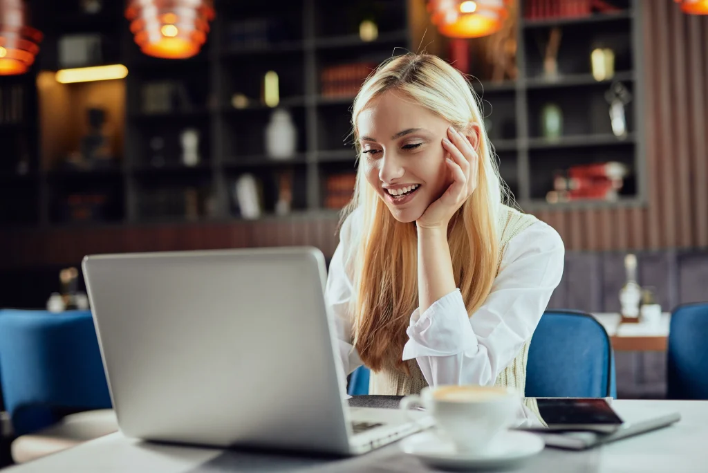 A woman using online banking features on her laptop