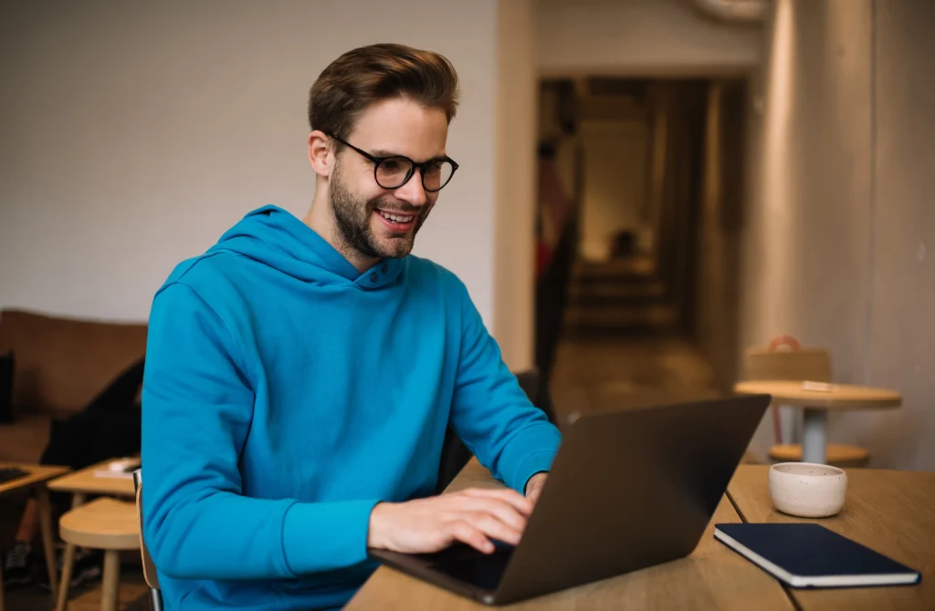 A man using online banking on his laptop.