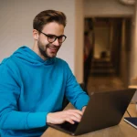 A man using online banking on his laptop.