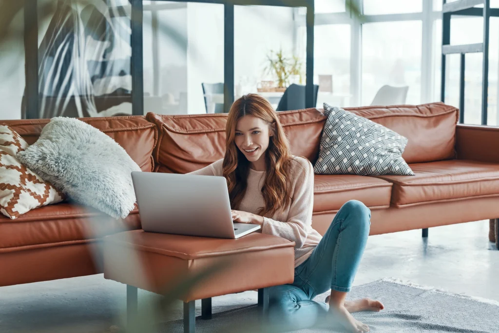 A woman on her laptop using Ancoria Bank's online banking services.